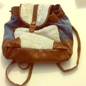 Leather, jean and white lace backpack